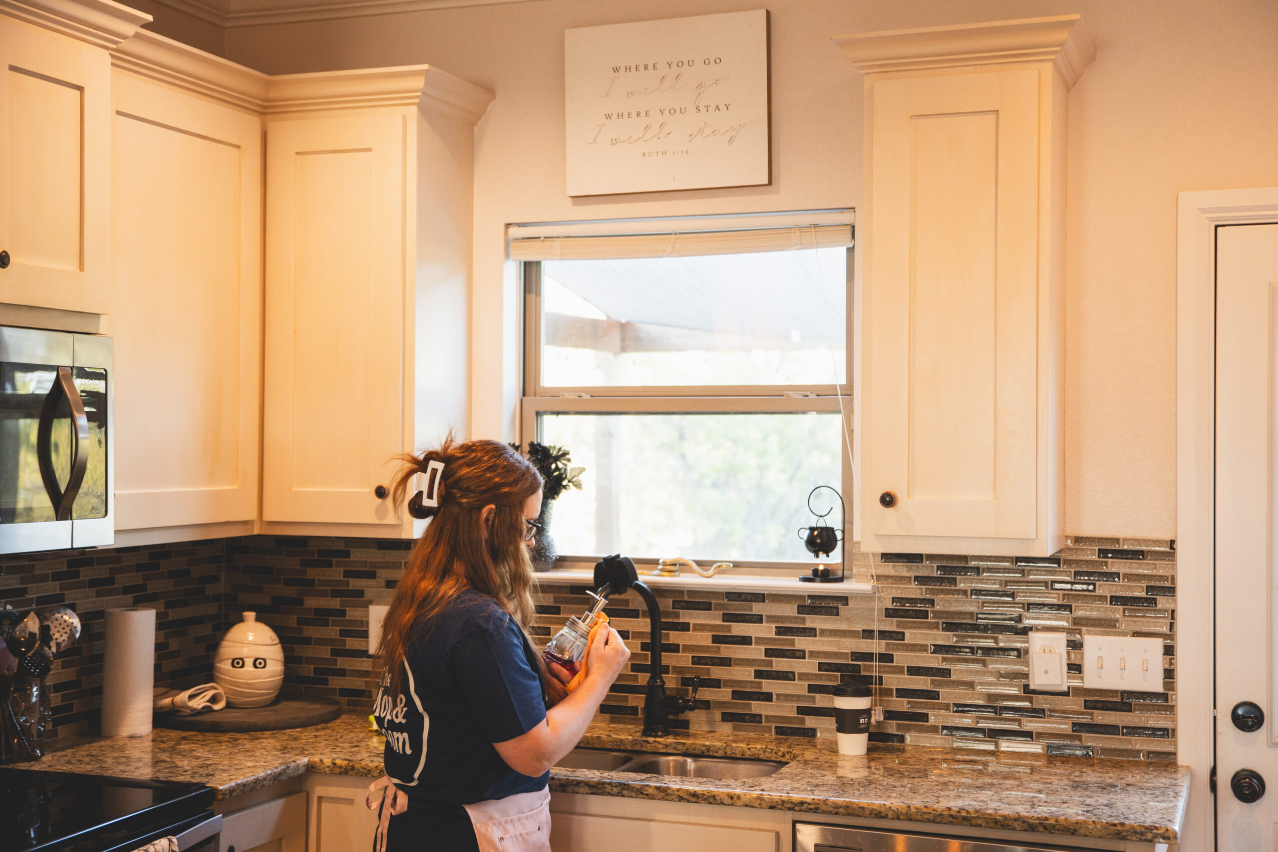 A cleaning professional from The Mop & Broom provides thorough cleaning services in Crowley