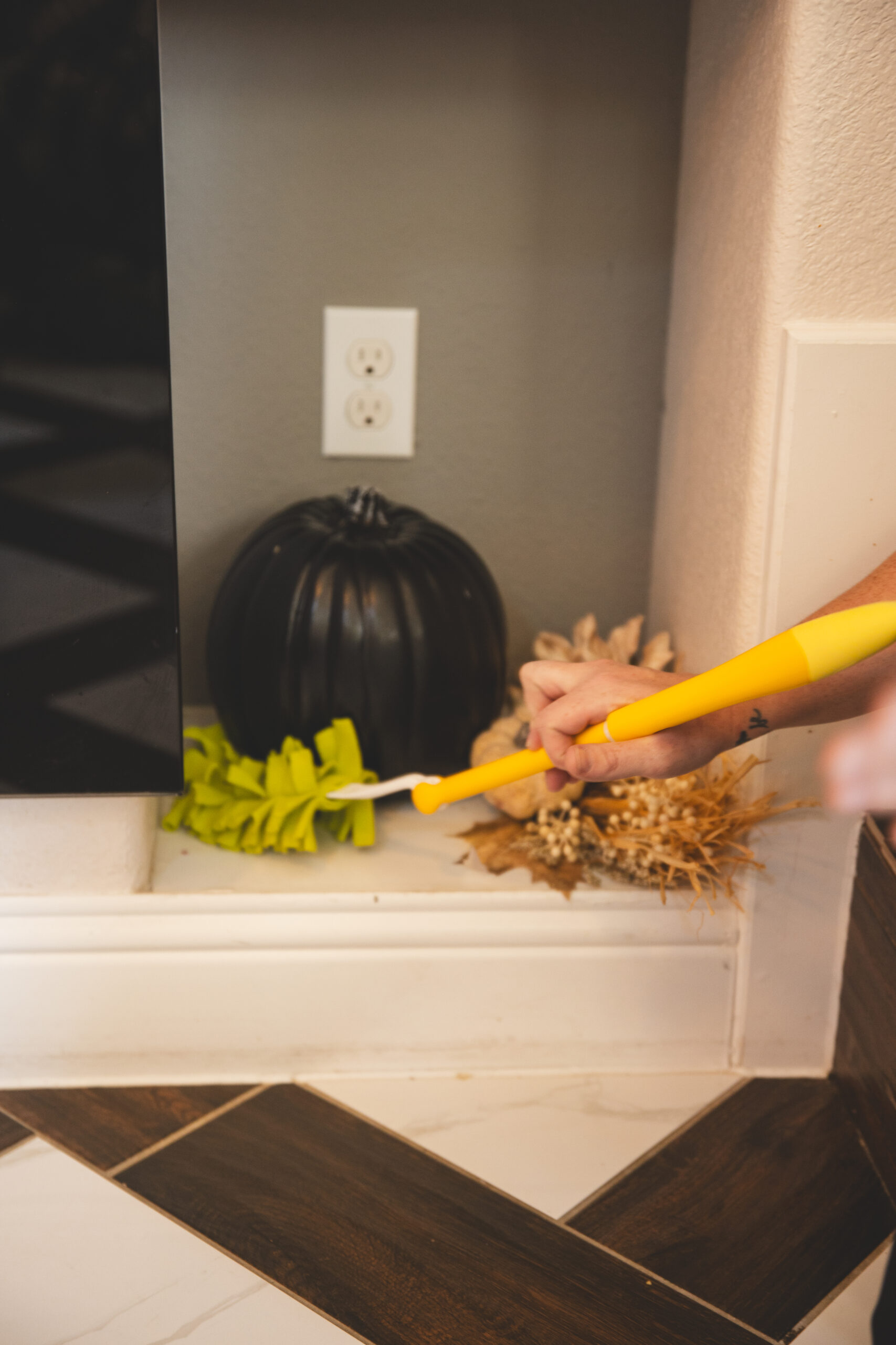 Professional maid services near me by The Mop & Broom, cleaning floors with spray and cloth