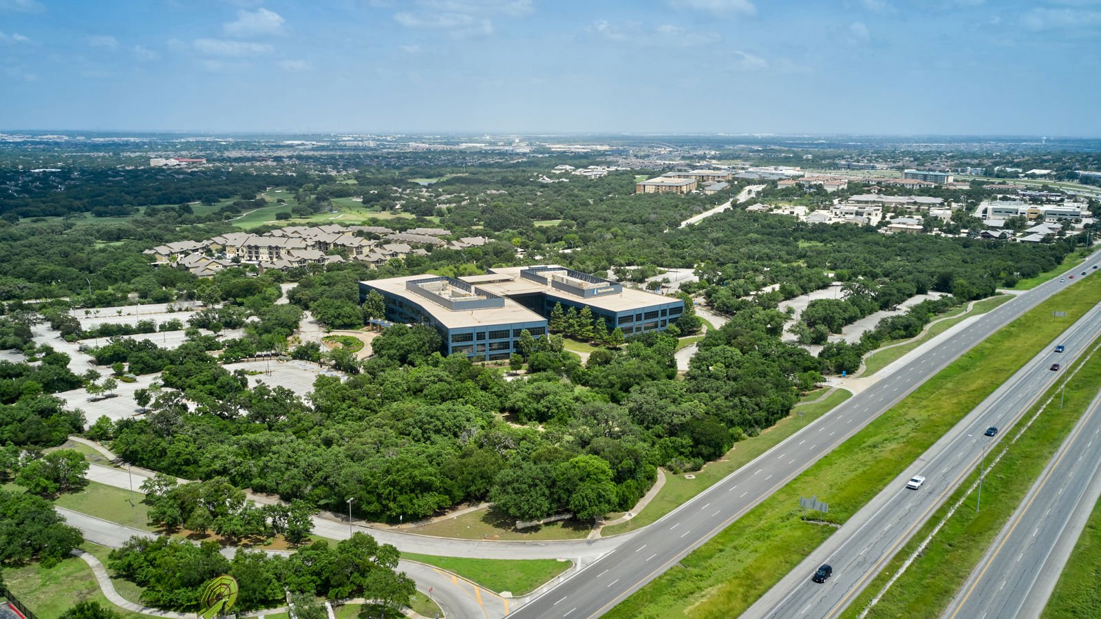 A worker from The Mop & Broom cleans a kitchen sink in Burleson, showcasing their professional cleaning services.